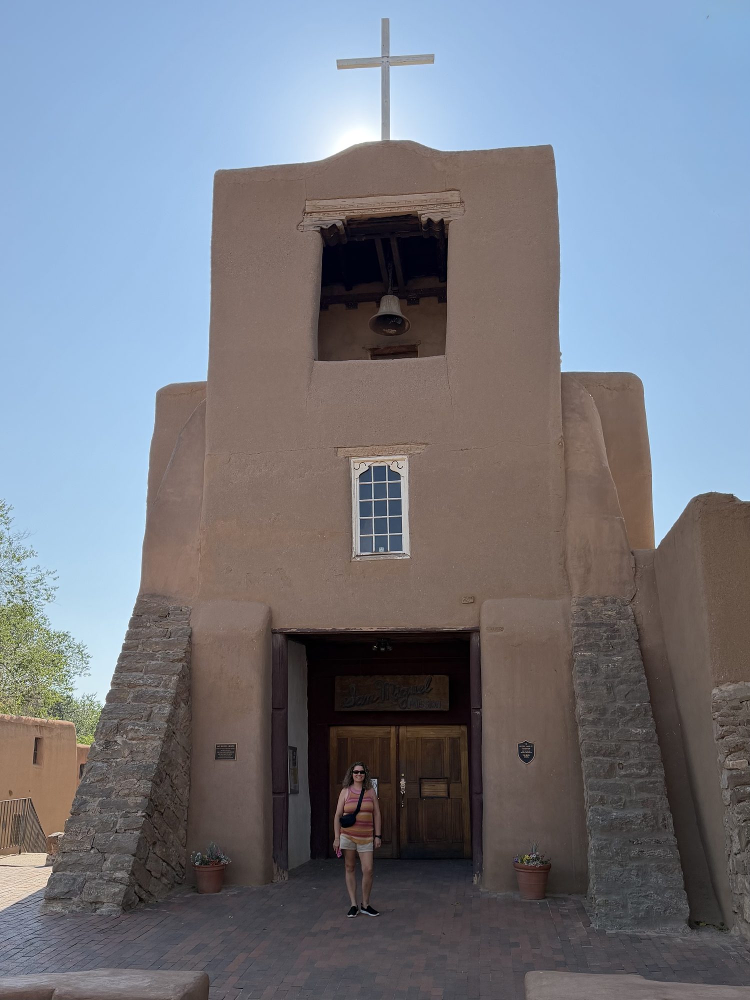 Linda outside San Miguel Chapel in Santa Fe
