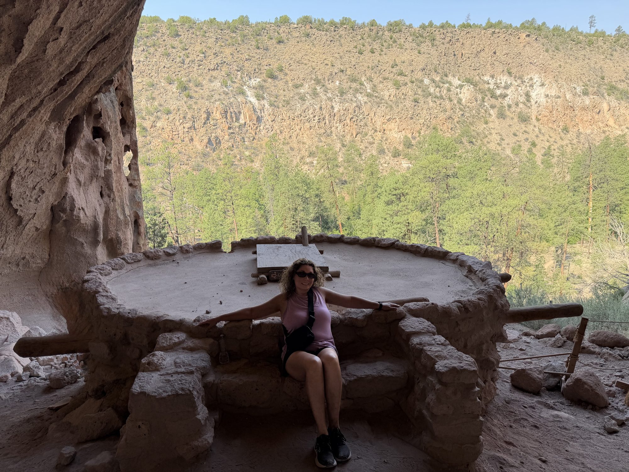 Linda inside one of the cliff dwellings overlooking Frijoles Canyon